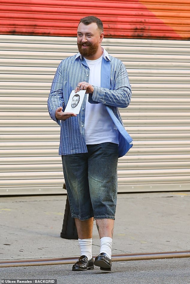 Sam Smith, 31, looked pleased after having their portrait drawn while out in New York City on Thursday