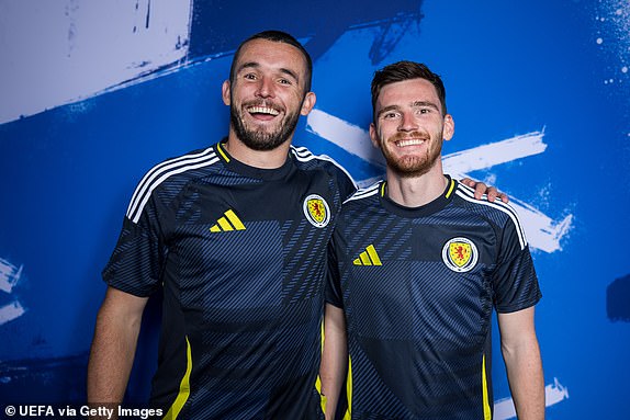 GLASGOW, SCOTLAND - MAY 30: John McGinn and Andrew Robertson of Scotland pose for a portrait during the Scotland Portrait session ahead of the UEFA EURO 2024 Germany on May 30, 2024 in Glasgow, Scotland. (Photo by Alex Pantling - UEFA/UEFA via Getty Images)