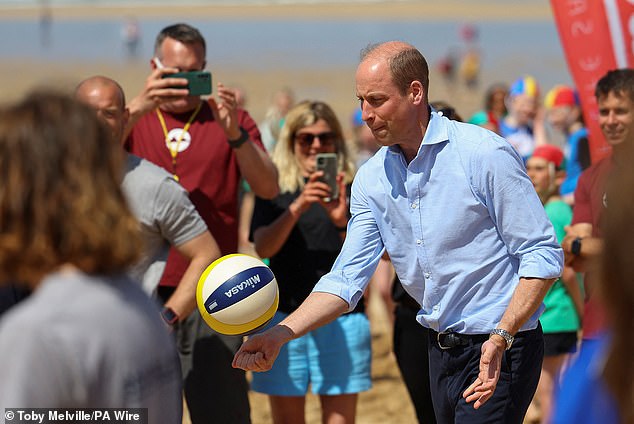 MAY 9: The Prince of Wales, known as the Duke of Cornwall when in Cornwall, plays volleyball during a visit to Fistrall Beach in Newquay