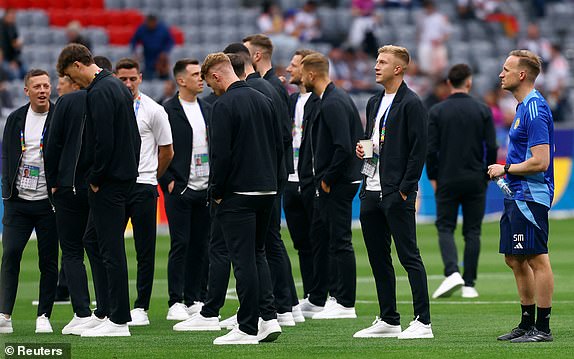 Soccer Football - Euro 2024 - Group A - Germany v Scotland - Munich Football Arena, Munich, Germany - June 14, 2024  Scotland's Ross McCrorie with teammates on the pitch before the match REUTERS/Kai Pfaffenbach