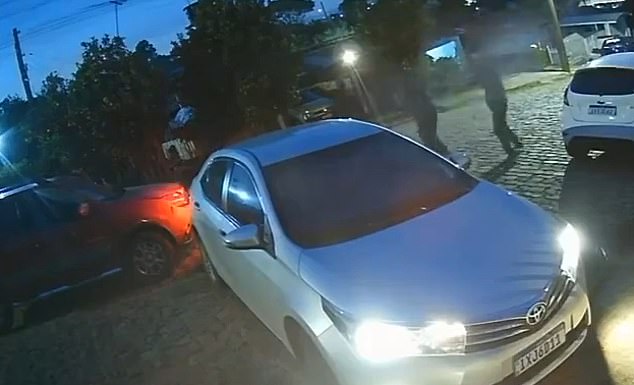 Brazilian authorities are searching for two gunmen who were seen on video unleashing a hail of bullets at a car of a 29-year-old man and his wife in the southeastern Brazilian state of Rio Grande do Sul last month. The man was wounded in the shoulder and his wife was not injured. No arrests have been made