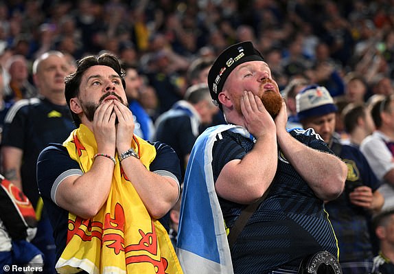 Soccer Football - Euro 2024 - Group A - Germany v Scotland - Munich Football Arena, Munich, Germany - June 14, 2024 Scotland fans look dejected during the second half of the match REUTERS/Angelika Warmuth     TPX IMAGES OF THE DAY