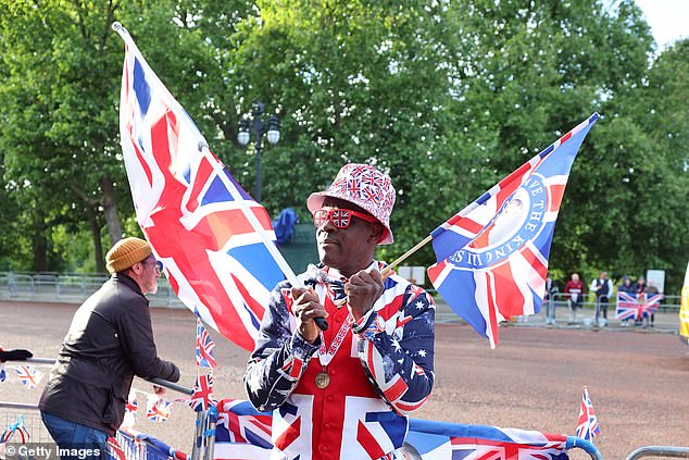 Royal fan Joseph Afrane stands on The Mall this morning ahead of Trooping the Colour