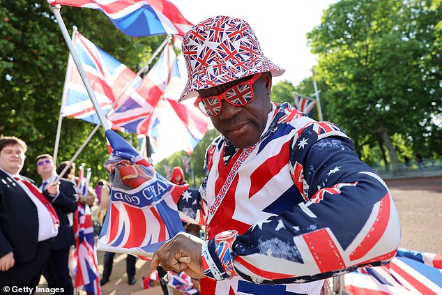 Royal fan Joseph Afrane stands on The Mall this morning ahead of Trooping the Colour