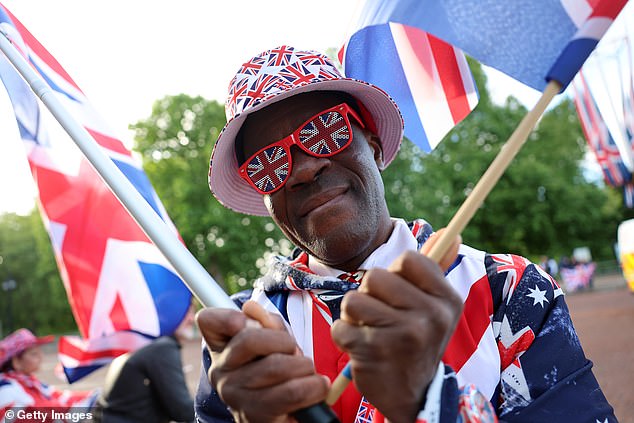 Royal fan Joseph Afrane stands on The Mall this morning ahead of Trooping the Colour