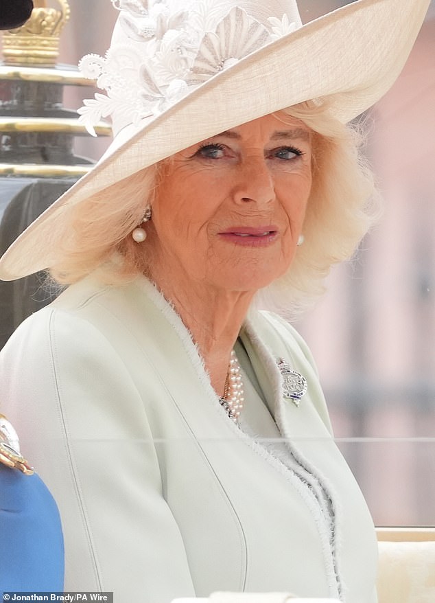 Queen Camilla travels along The Mall to the Trooping the Colour ceremony today