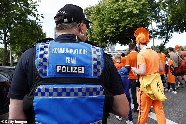 There is a heavy police presence in Hamburg but no signs of any trouble with fans in good spirits