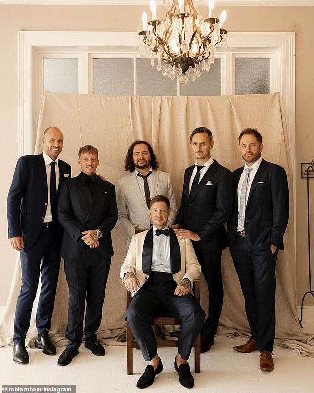 Rob posed alongside his groomsmen for one candid image