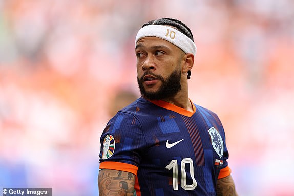 HAMBURG, GERMANY - JUNE 16: Memphis Depay of the Netherlands looks on during the UEFA EURO 2024 group stage match between Poland and Netherlands at Volksparkstadion on June 16, 2024 in Hamburg, Germany.   (Photo by Julian Finney/Getty Images)