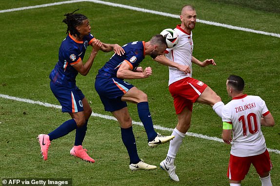 Netherlands' defender #06 Stefan de Vrij (C) heads the ball during the UEFA Euro 2024 Group D football match between Poland and the Netherlands at the Volksparkstadion in Hamburg on June 16, 2024. (Photo by Christophe SIMON / AFP) (Photo by CHRISTOPHE SIMON/AFP via Getty Images)