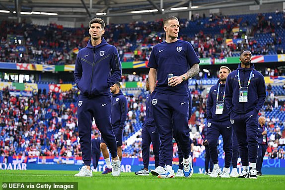 GELSENKIRCHEN, GERMANY - JUNE 16: John Stones and Jordan Pickford of England inspect the pitch prior to the UEFA EURO 2024 group stage match between Serbia and England at Arena AufSchalke on June 16, 2024 in Gelsenkirchen, Germany.   (Photo by Michael Regan - UEFA/UEFA via Getty Images)