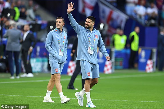 GELSENKIRCHEN, GERMANY - JUNE 16: Aleksandar Mitrovic of Serbia acknowledges the fans as he inspects the pitch prior to the UEFA EURO 2024 group stage match between Serbia and England at Arena AufSchalke on June 16, 2024 in Gelsenkirchen, Germany.   (Photo by Richard Pelham/Getty Images)