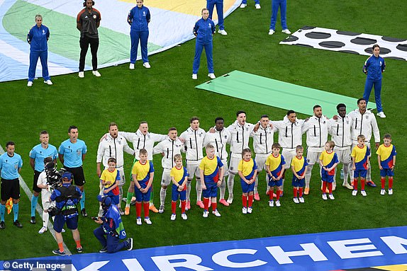GELSENKIRCHEN, GERMANY - JUNE 16: The players of England line up for their national anthem prior to kick-off ahead of the UEFA EURO 2024 group stage match between Serbia and England at Arena AufSchalke on June 16, 2024 in Gelsenkirchen, Germany.   (Photo by Matthias Hangst/Getty Images)