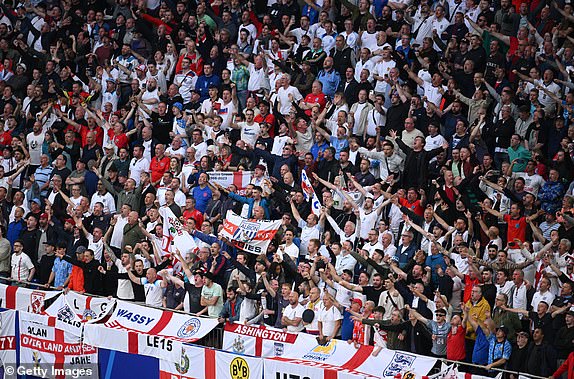 GELSENKIRCHEN, GERMANY - JUNE 16: Fans of England sing their national anthem prior to kick-off ahead of the UEFA EURO 2024 group stage match between Serbia and England at Arena AufSchalke on June 16, 2024 in Gelsenkirchen, Germany.   (Photo by Matthias Hangst/Getty Images)