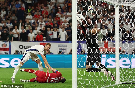 GELSENKIRCHEN, GERMANY - JUNE 16: Harry Kane of England looks on as Predrag Rajkovic of Serbia saves his shot as he pushes it onto the crossbar during the UEFA EURO 2024 group stage match between Serbia and England at Arena AufSchalke on June 16, 2024 in Gelsenkirchen, Germany.   (Photo by Richard Pelham/Getty Images)
