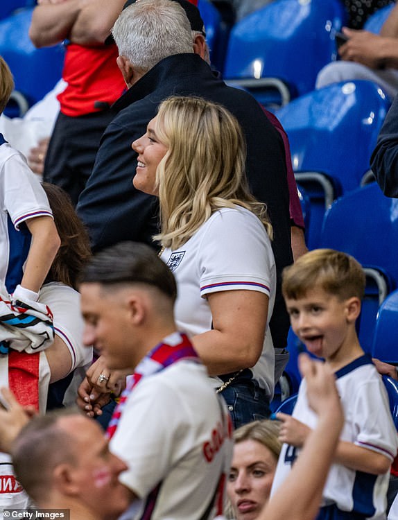 GELSENKIRCHEN, GERMANY - JUNE 16: Katie Goodland, wife of Harry Kane, and their family in the stands before the UEFA EURO 2024 group stage match between Serbia and England at Arena AufSchalke on June 16, 2024 in Gelsenkirchen, Germany. (Photo by Kevin Voigt/GettyImages)