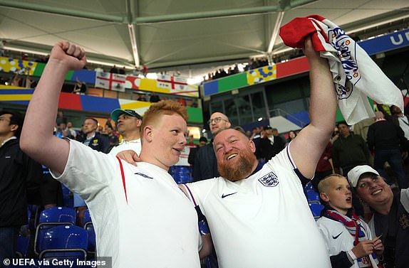GELSENKIRCHEN, GERMANY - JUNE 16: Fans of England celebrate victory after England defeat Serbia during the UEFA EURO 2024 group stage match between Serbia and England at Arena AufSchalke on June 16, 2024 in Gelsenkirchen, Germany.   (Photo by Angel Martinez - UEFA/UEFA via Getty Images)