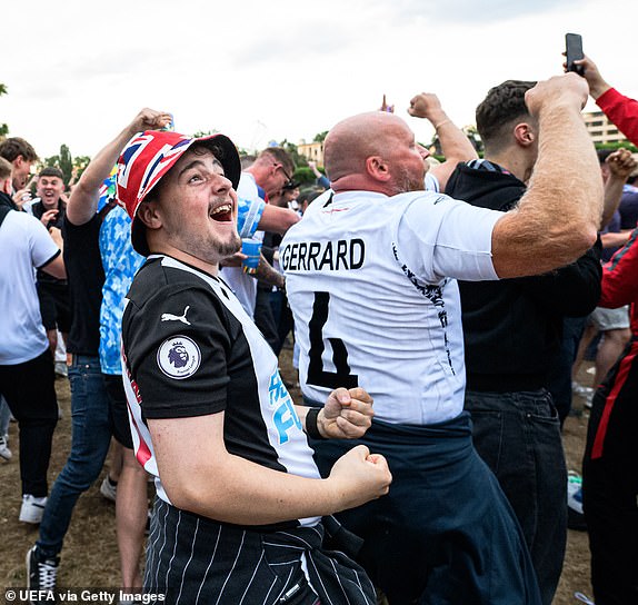 FRANKFURT, GERMANY - JUNE 16: England fans celebrates at the official UEFA Fan Zone during the UEFA EURO 2024 Group C match between Serbia and England at the Fan Zone on June 16, 2024 in Frankfurt, Germany.(Photo by Neil Baynes - UEFA/UEFA via Getty Images)