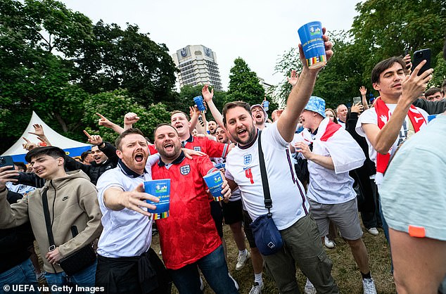 Fans at the ground had to fork out seven euros for a low-strength beer - and an extra three for a reusable cup (pictured at the fan zone in Frankfurt)