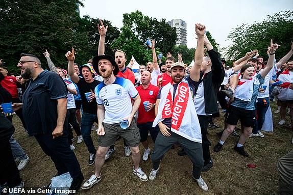 FRANKFURT, GERMANY - JUNE 16: England fans celebrates at the official UEFA Fan Zone during the UEFA EURO 2024 Group C match between Serbia and England at the Fan Zone on June 16, 2024 in Frankfurt, Germany.(Photo by Neil Baynes - UEFA/UEFA via Getty Images)