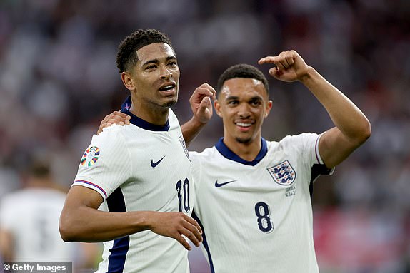 GELSENKIRCHEN, GERMANY - JUNE 16: Jude Bellingham of England celebrates scoring his team's first goal with teammate Trent Alexander-Arnold during the UEFA EURO 2024 group stage match between Serbia and England at Arena AufSchalke on June 16, 2024 in Gelsenkirchen, Germany.   (Photo by Kevin C. Cox/Getty Images)