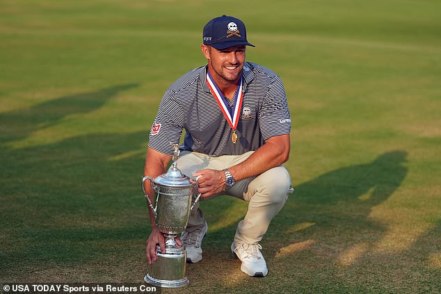 Bryson DeChambeau poses with the trophy after dramatically winning the US Open