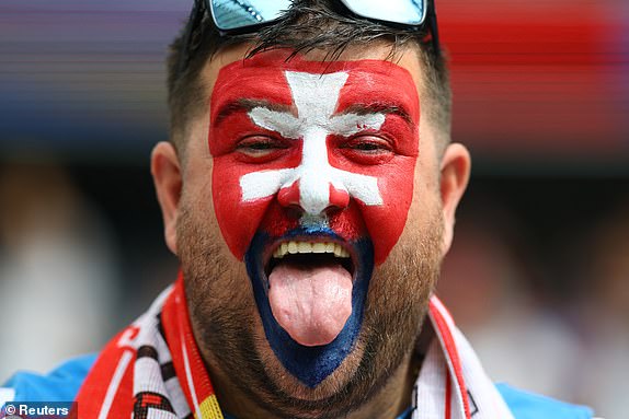 Soccer Football - Euro 2024 - Group E - Belgium v Slovakia - Frankfurt Arena, Frankfurt, Germany - June 17, 2024 Slovakia fan with his face painted reacts inside the stadium before the match REUTERS/Kai Pfaffenbach