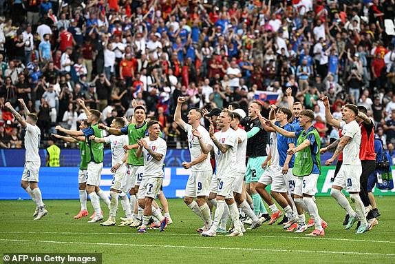 Slovakia's players celebrate after winning the UEFA Euro 2024 Group E football match between Belgium and Slovakia at the Frankfurt Arena in Frankfurt am Main on June 17, 2024. (Photo by JAVIER SORIANO / AFP) (Photo by JAVIER SORIANO/AFP via Getty Images)