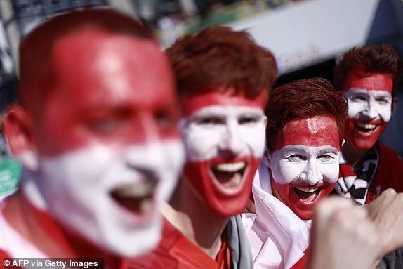 Sopporters of Austria pose ahead of the UEFA Euro 2024 Group D football match between Austria and France at the Duesseldorf Arena in Duesseldorf on June 17, 2024. (Photo by KENZO TRIBOUILLARD / AFP) (Photo by KENZO TRIBOUILLARD/AFP via Getty Images)