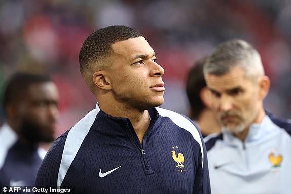 France's forward #10 Kylian Mbappe reacts as he warms up prior to the UEFA Euro 2024 Group D football match between Austria and France at the Duesseldorf Arena in Duesseldorf on June 17, 2024. (Photo by FRANCK FIFE / AFP) (Photo by FRANCK FIFE/AFP via Getty Images)