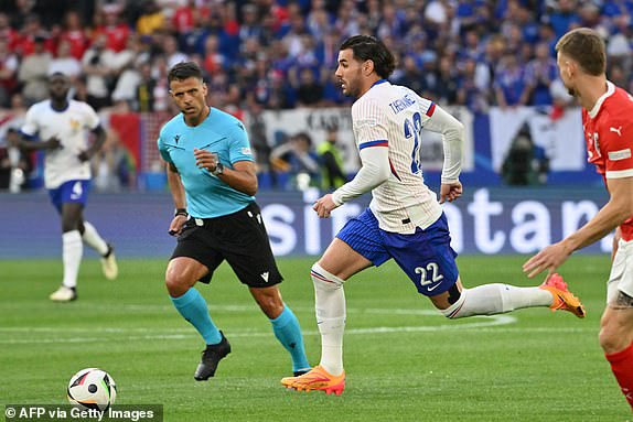 France's defender #22 Theo Hernandez runs with the ball during the UEFA Euro 2024 Group D football match between Austria and France at the Duesseldorf Arena in Duesseldorf on June 17, 2024. (Photo by Alberto PIZZOLI / AFP) (Photo by ALBERTO PIZZOLI/AFP via Getty Images)