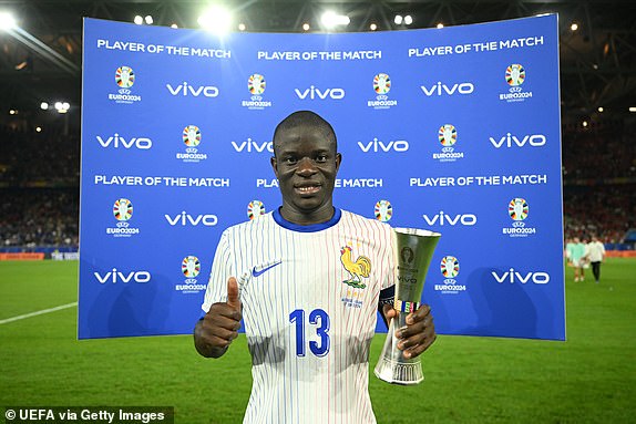 DUSSELDORF, GERMANY - JUNE 17: N'Golo Kante of France poses for a photo with the Vivo Player of the Match award after the UEFA EURO 2024 group stage match between Austria and France at DÃ¼sseldorf Arena on June 17, 2024 in Dusseldorf, Germany. (Photo by Michael Regan - UEFA/UEFA via Getty Images)