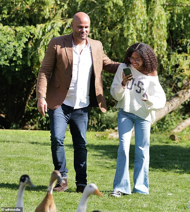 The father-daughter duo couldn't wipe the smile off their faces as they played with dogs, ducks and goats in the back garden