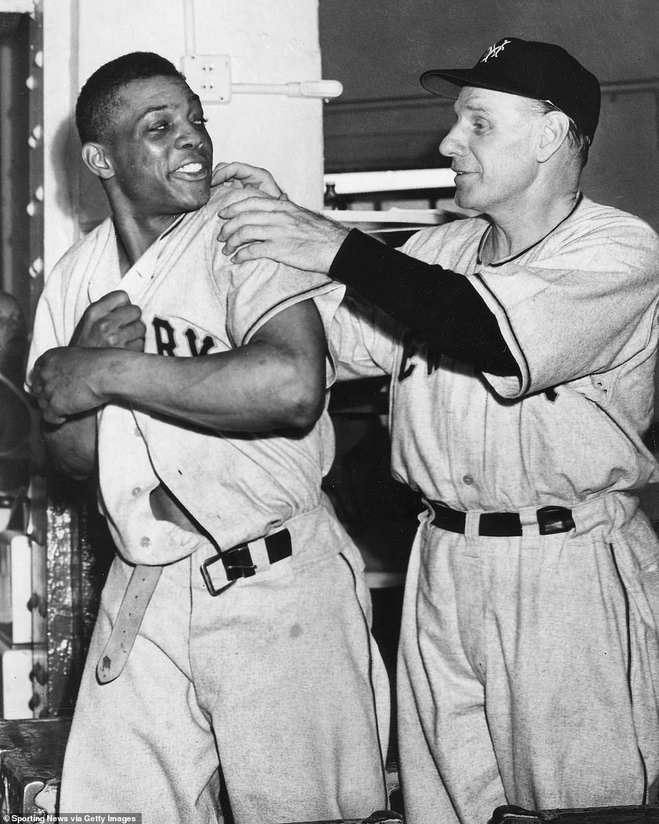 Mays jokes with manager Leo Durocher of the New York Giants. Both are members of the Baseball Hall of Fame