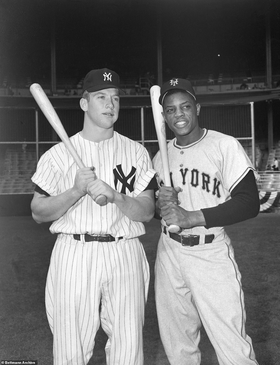 Mickey Mantle (L), poses with Willie Mays (R) at Yankee Stadium prior to the World Series in 1951