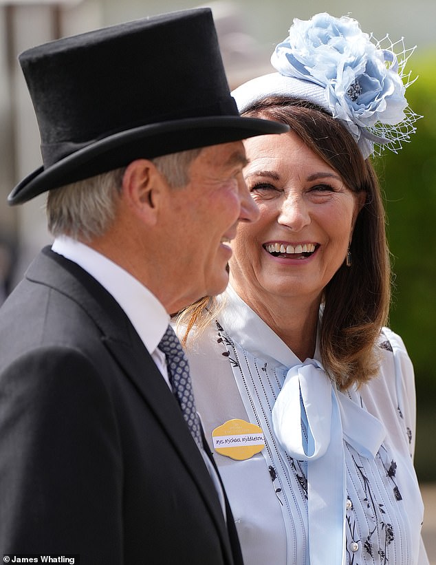 Carole echoed her oldest daughter's 2019 Philip Treacy hat with her a similar blue floral fascinator