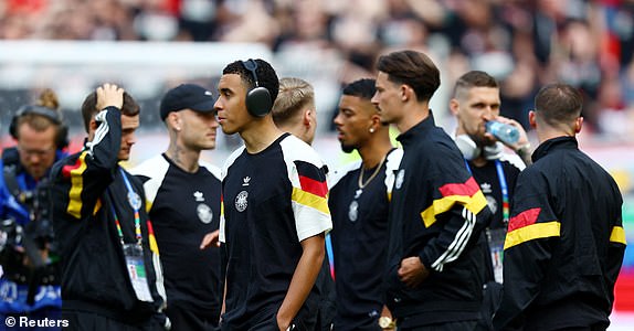 Soccer Football - Euro 2024 - Group A - Germany v Hungary - Stuttgart Arena, Stuttgart, Germany - June 19, 2024 Germany's Jamal Musiala with teammates inside the stadium before the match REUTERS/Kai Pfaffenbach