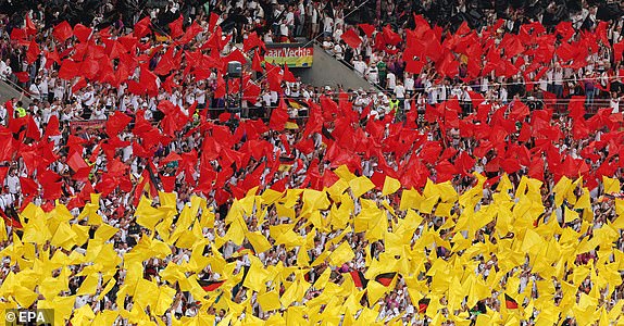 epa11423041 Supporters of Germany cheer ahead of the UEFA EURO 2024 Group A soccer match between Germany and Hungary, in Stuttgart, Germany, 19 June 2024.  EPA/MOHAMED MESSARA