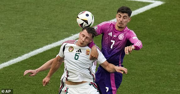 Hungary's Barnabas Varga (19), Willi Orban (6), and Germany's Kai Havertz (7) head the ball during a Group A match between Germany and Hungary at the Euro 2024 soccer tournament in Stuttgart, Germany, Wednesday, June 19, 2024. (AP Photo/Themba Hadebe)