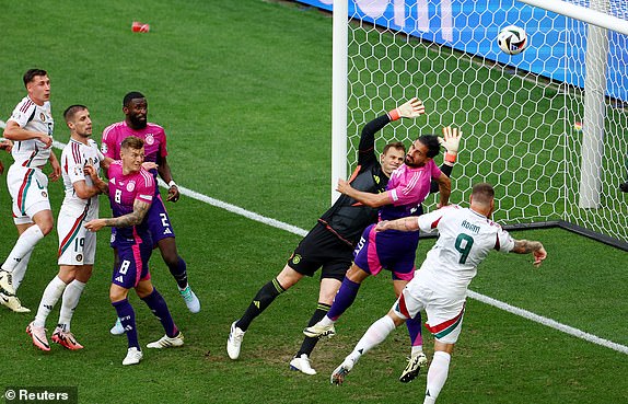 Soccer Football - Euro 2024 - Group A - Germany v Hungary - Stuttgart Arena, Stuttgart, Germany - June 19, 2024 Hungary's Martin Adam in action with Germany's Emre Can and Manuel Neuer REUTERS/Leonhard Simon