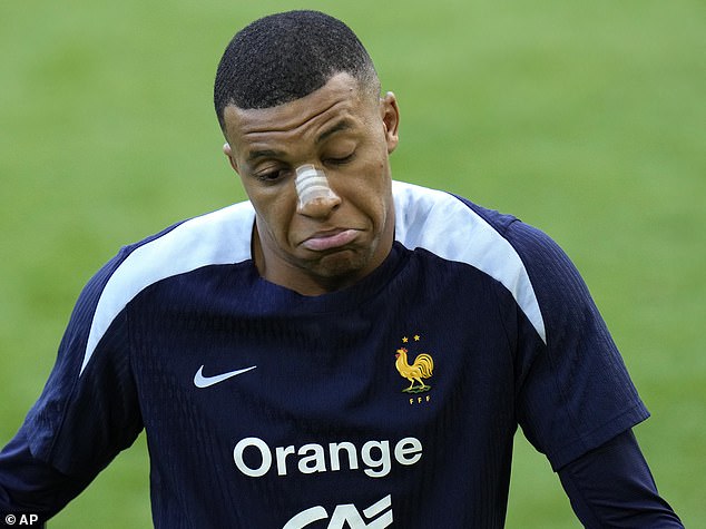 Kylian Mbappe has been pictured in training wearing bandages on his nose after his injury