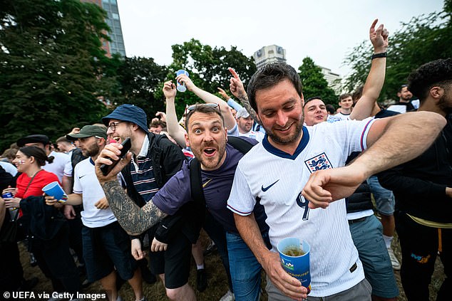 England fans celebrate at the UEFA Fan Zone in Frankfurt during the Serbia match on Sunday