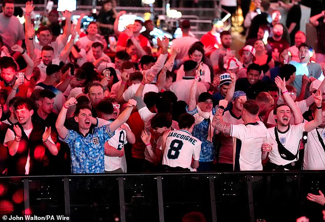 England fans at the Boxpark Wembley in London celebrate during the Serbia match on Sunday
