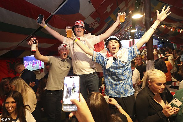 England fans celebrate after Sunday's match at the Douglas Tavern in Hebburn, Tyne and Wear