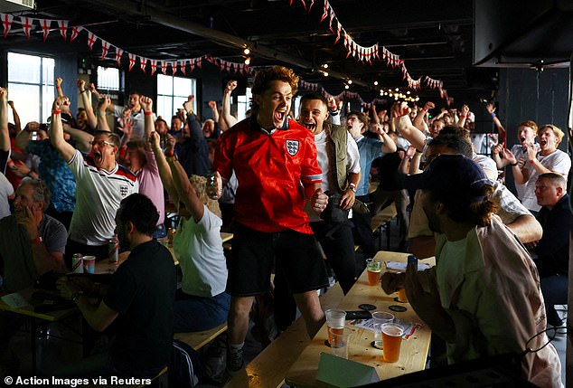 England fans at 4TheFans Fans Park in Dalston, East London, celebrate after Sunday's win