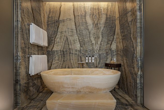 For ultimate relaxation, you can enjoy a warm aromatherapy bath in a stone soaking tub