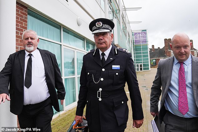 Nick Adderley (pictured, centre, leaving his misconduct hearing in Northampton last month) has been accused of wearing a Falklands War medal despite being only 15 at the time