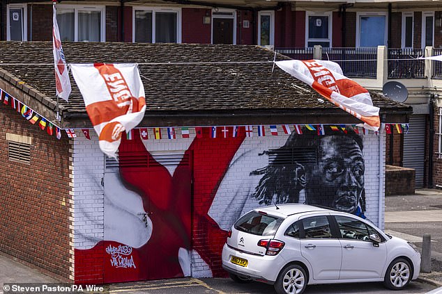 England flags at the Kirby Estate in South East London today ahead of the Denmark match