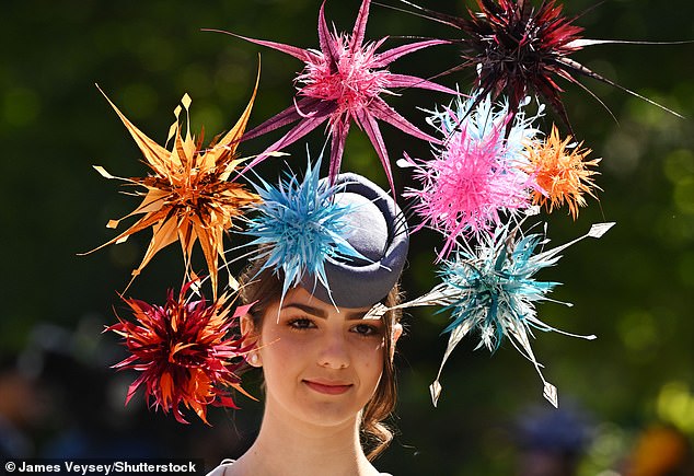 A woman wears a hat with explosions of random colour that stood out against the summer sky