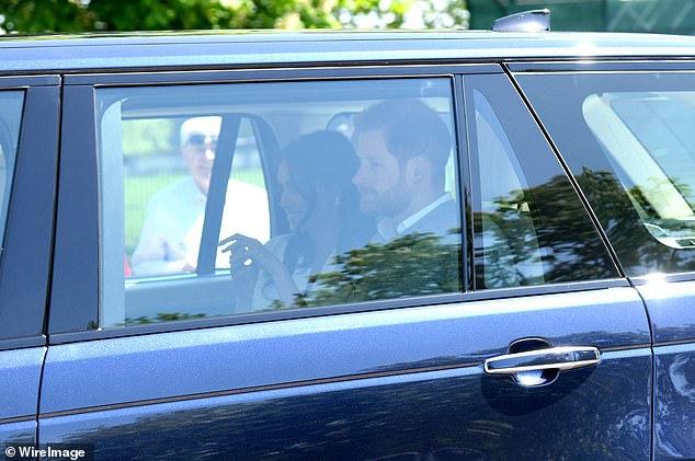 Prince Harry and Meghan Markle drive down the Long Walk in Windsor to their wedding rehearsal